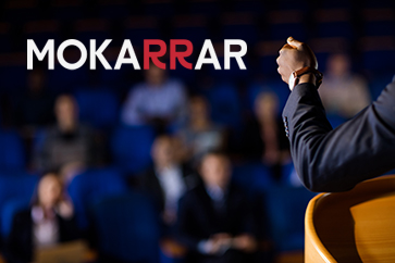 Male business executive giving a speech at conference center